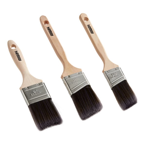 A group of three Allway Tools paint brushes with wooden handles.