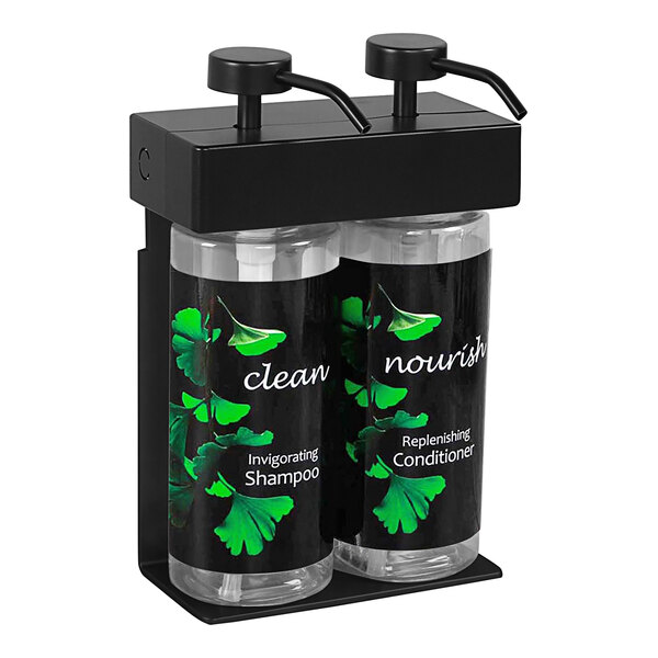 A black wall-mounted dispenser with two oval bottles of Ginkgo hand soap.