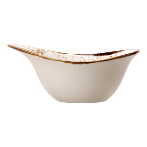 A close-up of a Steelite Performance Craft white bowl with brown speckles.