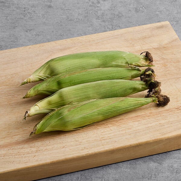 Fresh yellow corn on the cob on a table.