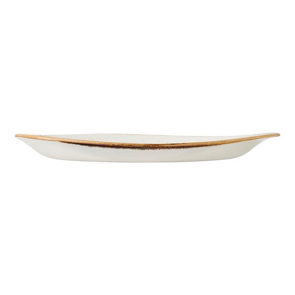 A white freestyle plate with a slightly raised rim and rustic brown edge.