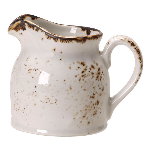 A white Steelite Performance Craft club jug with brown speckles.