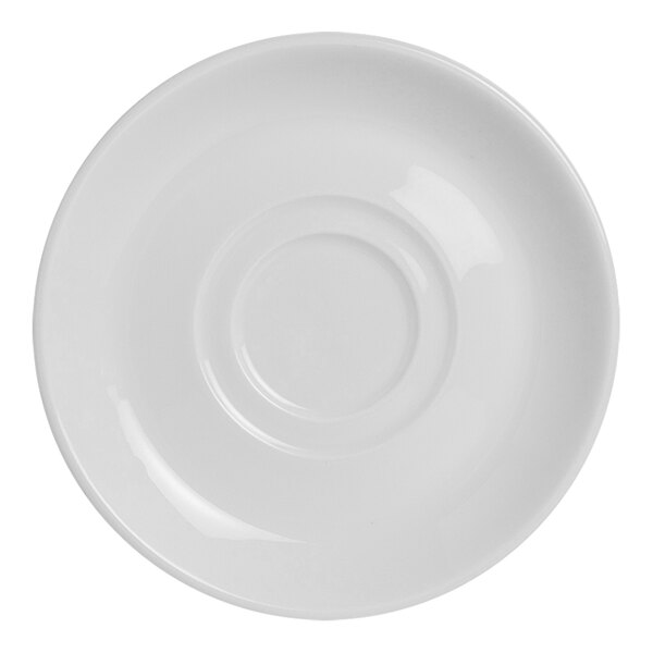 A white saucer with a circle in the middle.