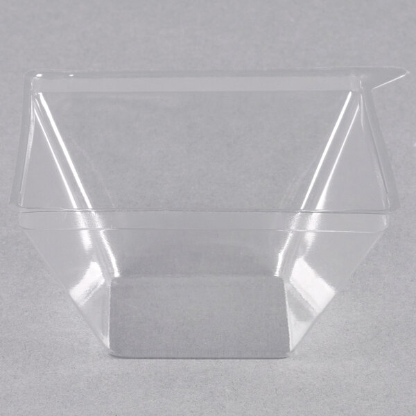 A clear plastic container lid for Fineline Tiny Temptations.