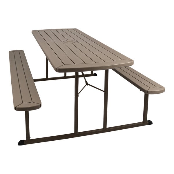 A National Public Seating brown folding picnic table with benches.