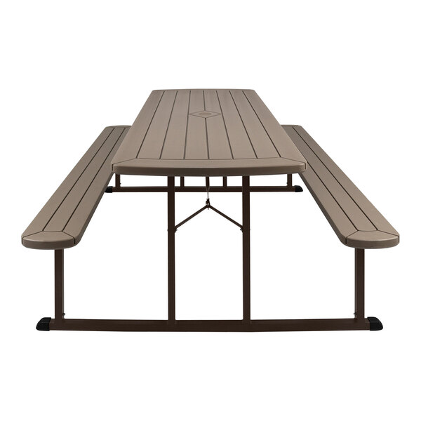 A National Public Seating brown folding picnic table with benches.