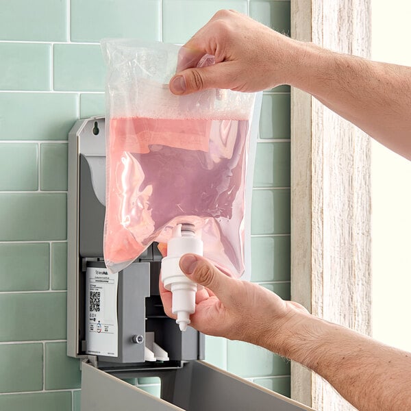 A person using Lavex Fruity Scent Foaming Hand Soap.