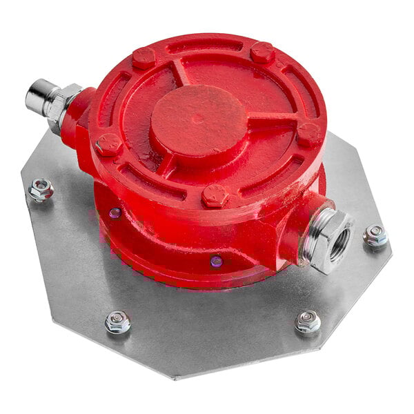 A red and silver metal Shortening Shuttle pump assembly with connectors.