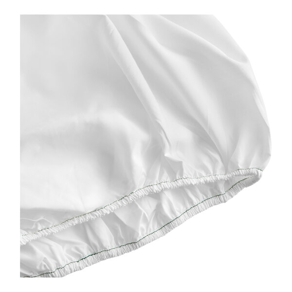 A white queen size fitted sheet with elastic edges made from modal and polyester.