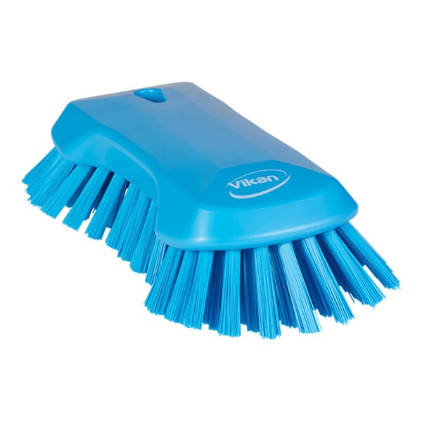 A blue Vikan scrub brush with stiff bristles.