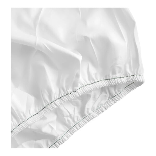 A white cotton and polyester blend fitted sheet with elastic edges.
