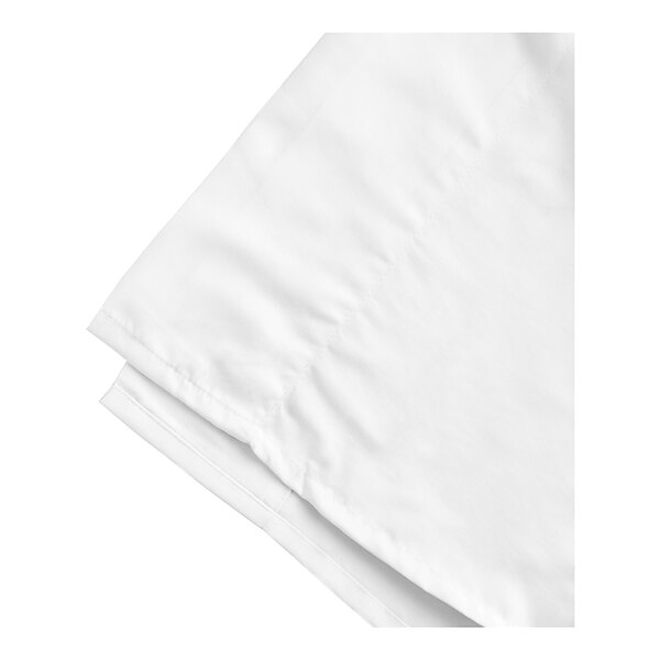 A white Oxford Micro Superblend flat sheet folded up on a white surface.