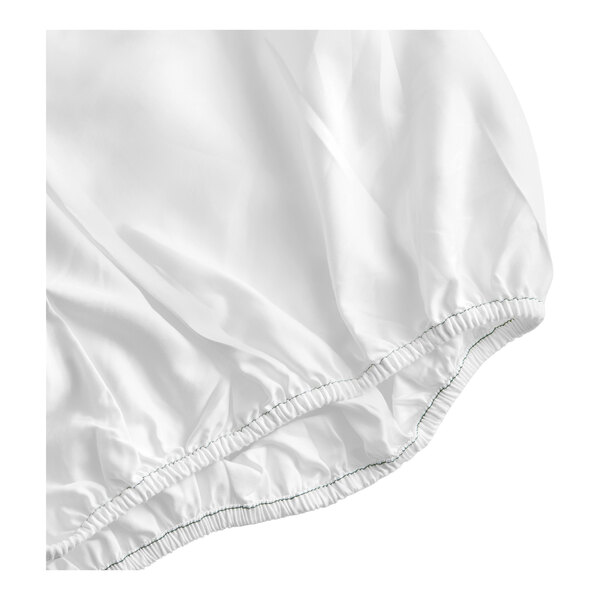 A white queen size fitted sheet made of 100% cotton with elastic edges.