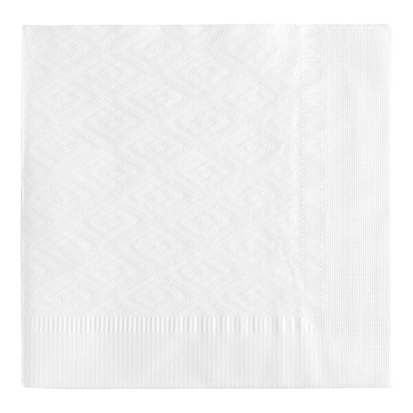 A white square napkin with a diamond pattern on a white surface.