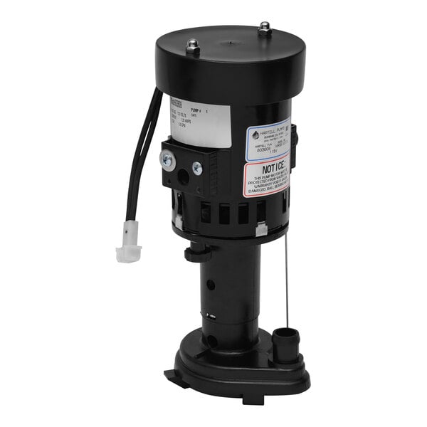 A black Hartell ice machine pump with a white label on a round object.