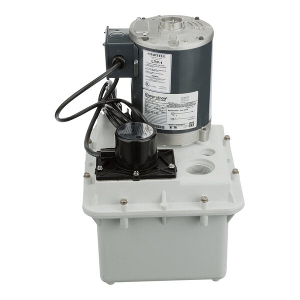 A white Hartell LTP-1 Series waste water drain pump box.