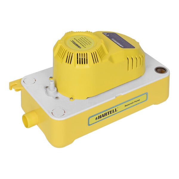 A yellow and white Hartell condensate pump.