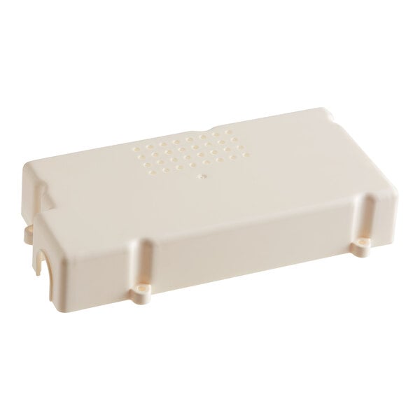 A white rectangular plastic lid with holes.