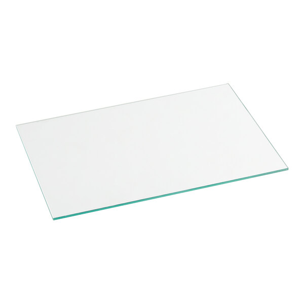 A rectangular glass shelf with green edges.