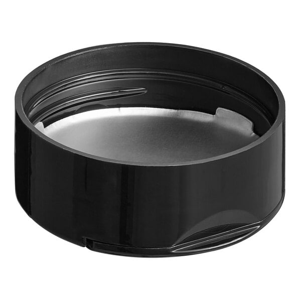 A black circular 48/485 spice lid with dual flappers and a silver induction liner with 3 holes.