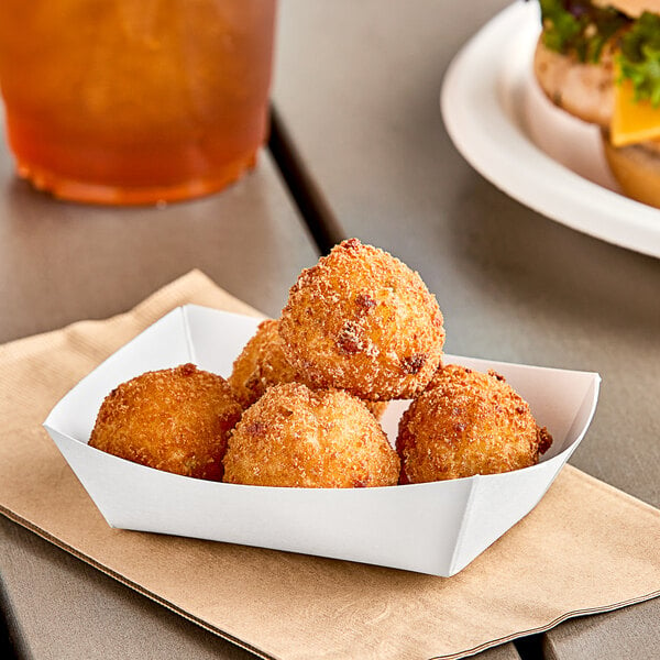 A Southern Champion white paper food tray holding fried food.