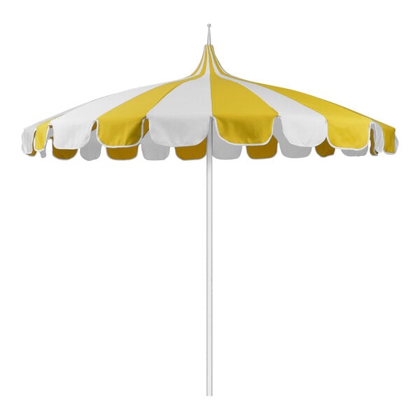 A California Umbrella with a natural and sunflower yellow striped canopy and a silver aluminum pole.