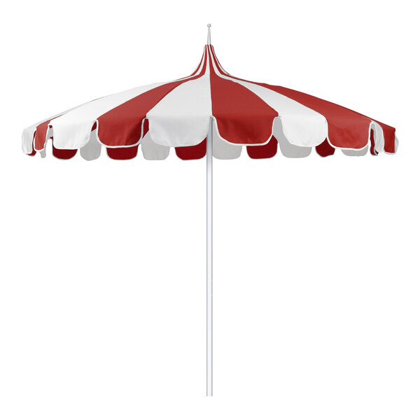 A natural white pole supporting a red and white striped Pagoda umbrella.