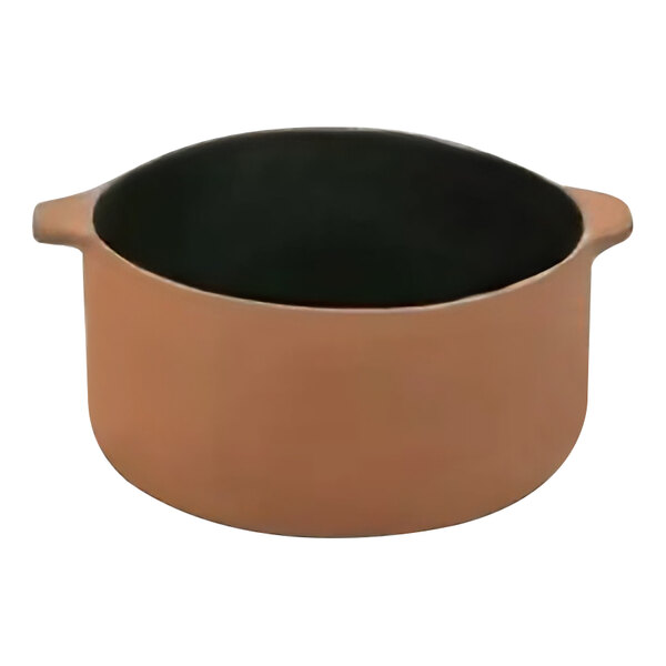 A gray stoneware au gratin dish with black handles.