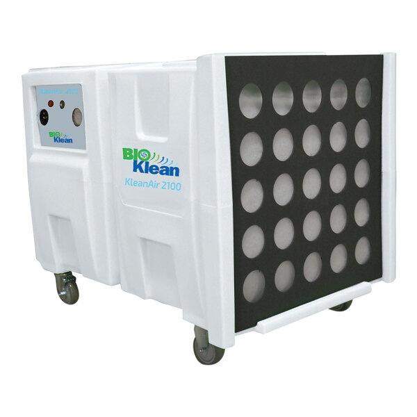 A white container with round holes on wheels.