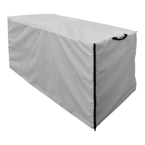 A white protective cover for an Indu rectangular outdoor table with a black handle.