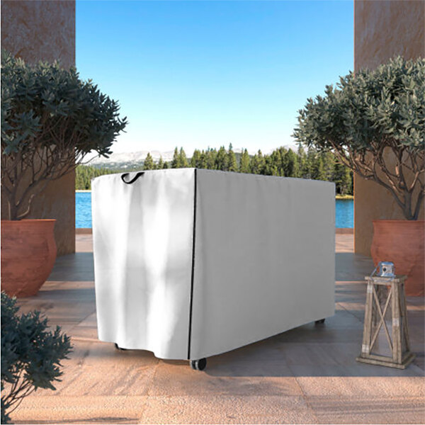 A white protective cover on an outdoor table.
