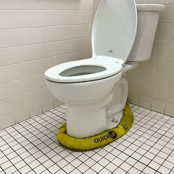 A Quick Dam water barrier around a toilet.