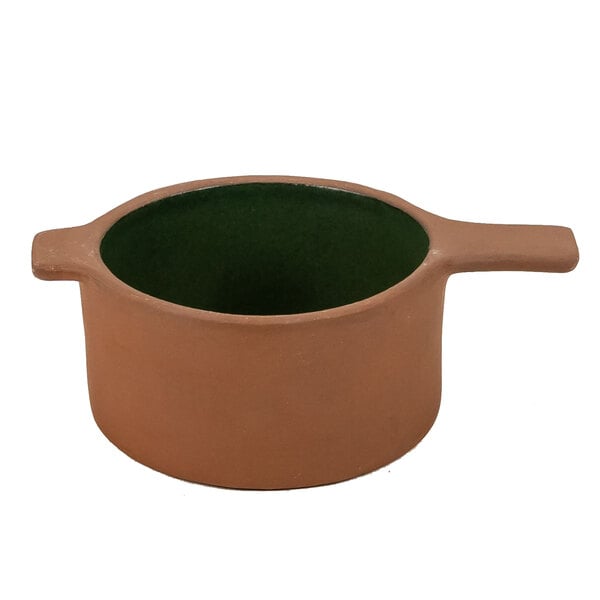 A brown terracotta au gratin dish with a green rim.