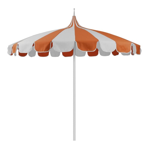 An orange and white striped pagoda umbrella with a white pole.