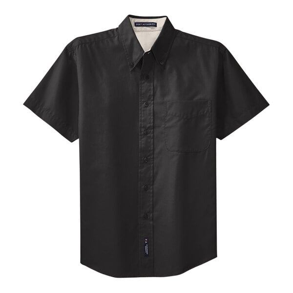 A black and light stone Port Authority men's short sleeve button-down shirt on a hanger.