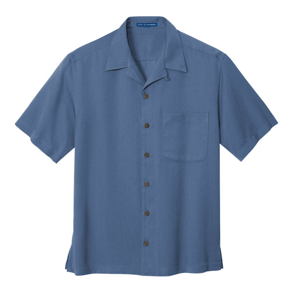 A Port Authority blue short sleeve camp shirt with a buttoned collar and a pocket.