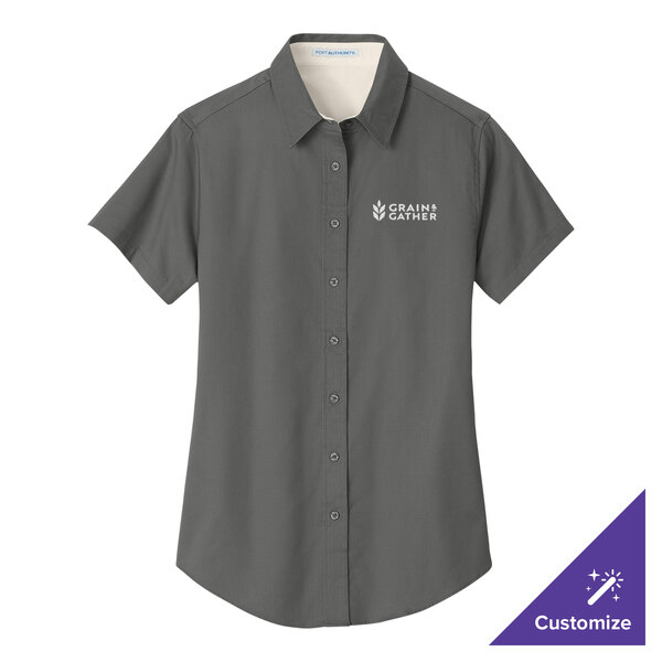 A Port Authority women's steel gray short sleeve dress shirt with logo on the chest.