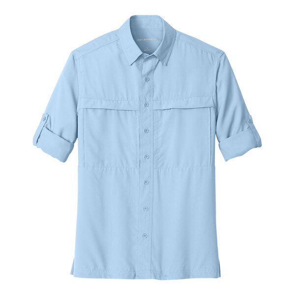 A Port Authority light blue long sleeve shirt with rolled up sleeves and a button.