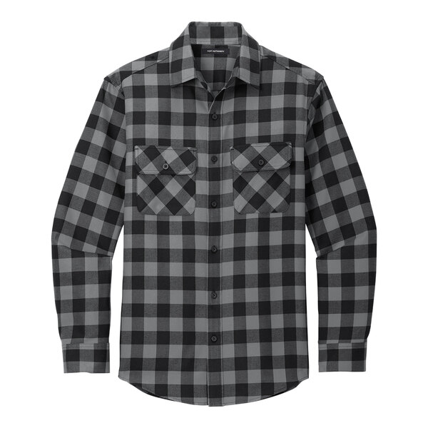 A Port Authority unisex long sleeved flannel shirt in black and grey plaid with a close up of the pocket.