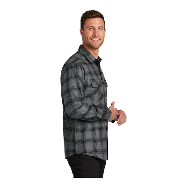 A man in a Port Authority gray and black plaid flannel shirt.
