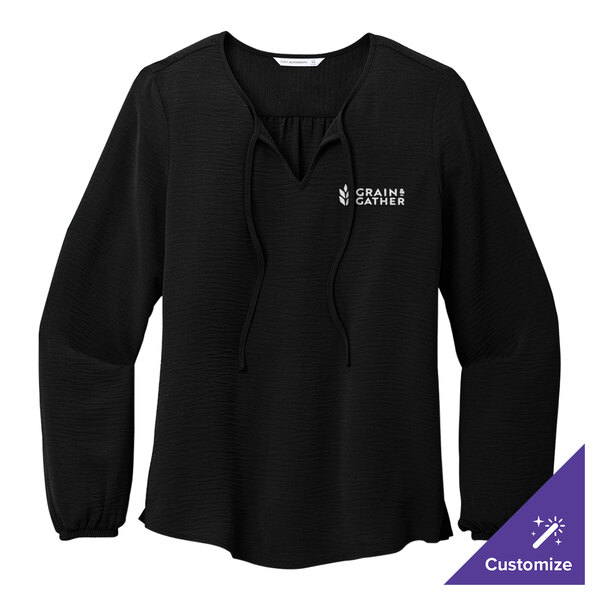 A Port Authority black long sleeve crepe blouse with a white logo that says, 'empower'