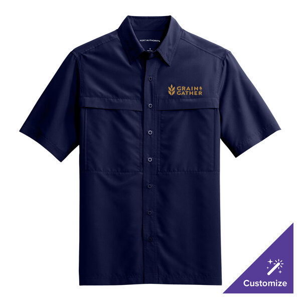 A navy Port Authority short sleeve shirt with gold embroidery.