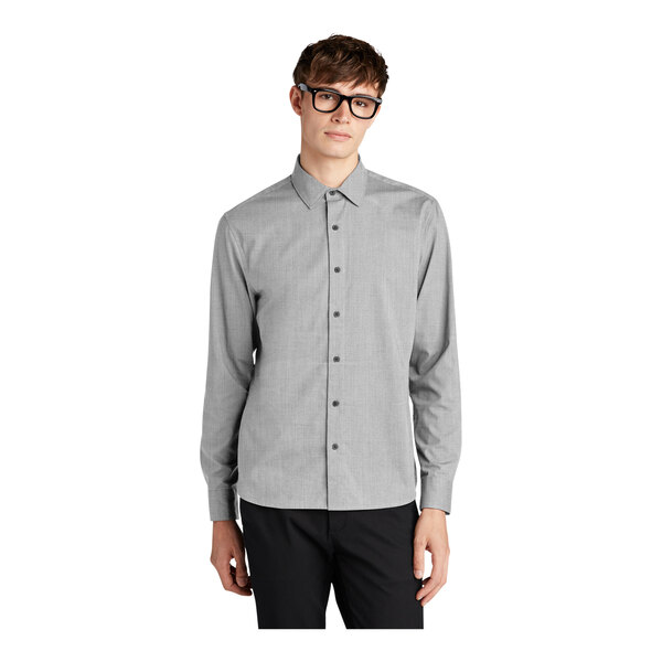 A man wearing a Mercer+Mettle customizable grey dress shirt.