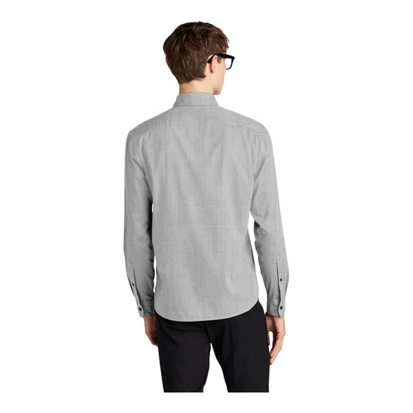 A man wearing a Mercer+Mettle gray long sleeve dress shirt.