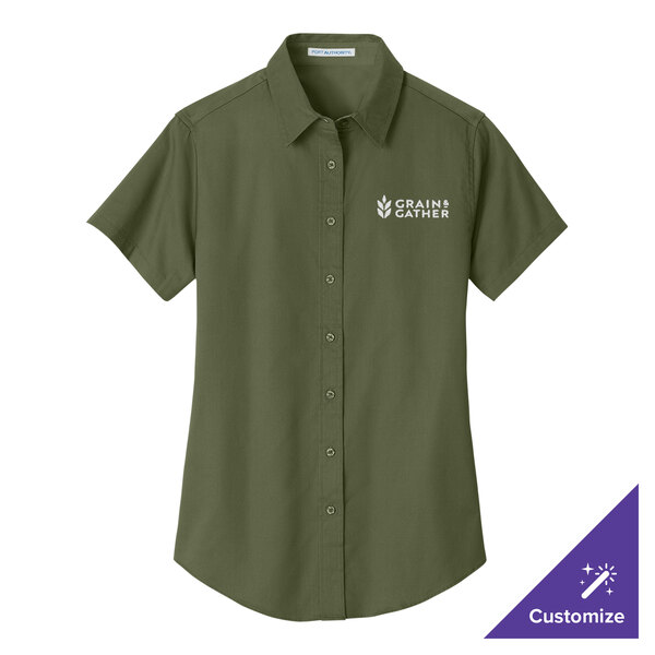 A Port Authority women's clover green short sleeve dress shirt with white logo text.