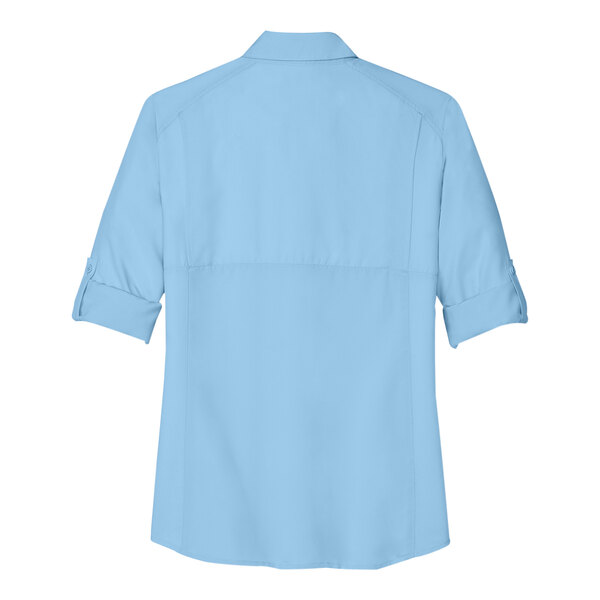 A light blue Port Authority short sleeve shirt for women.