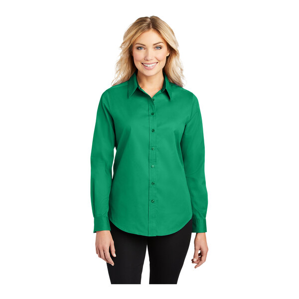 A woman wearing a Port Authority Court Green long sleeve dress shirt.