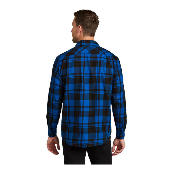 A man wearing a Port Authority blue and black plaid flannel shirt.
