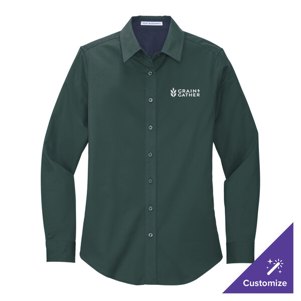 A dark green Port Authority long sleeve dress shirt with white logo on the chest.