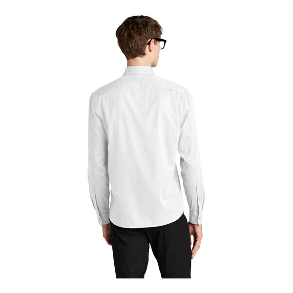 A man wearing a white Mercer+Mettle long sleeve dress shirt.